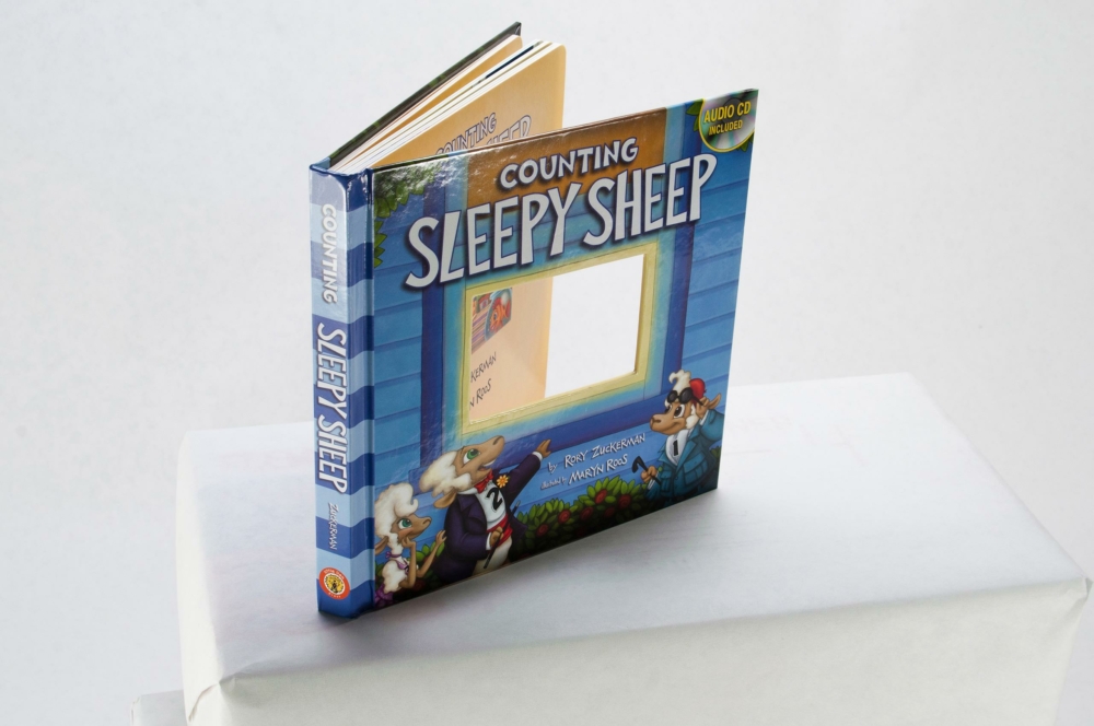 39997 Sleepy Sheep Globalpsd371 children's book, casebound board book with die cut window, CD included