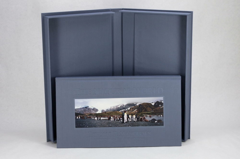 42782 MG 1957 clamshell box, cloth, hardcover, casebound, deep blind debossing, tip-on